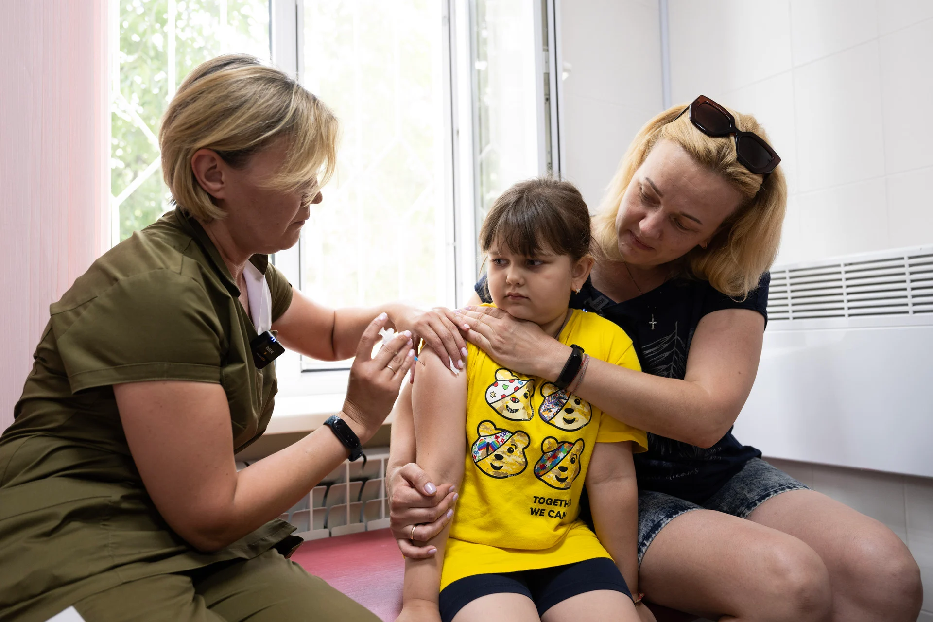 A young girl is vaccinated on 25 July 2023 at the Children's Department of the Brovary City Centre of Primary Medical and Sanitary Aid.