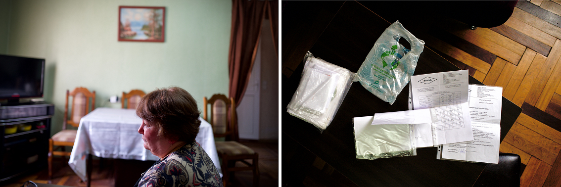A woman sits alone at home, and a COVID-19 self test kit
